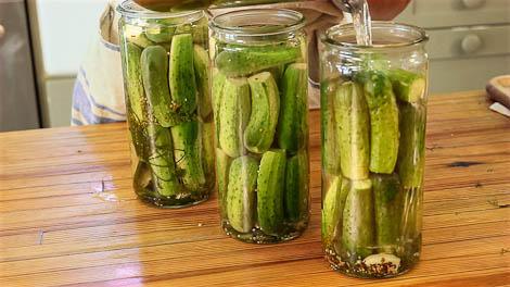 Glass jars filled with dill pickles