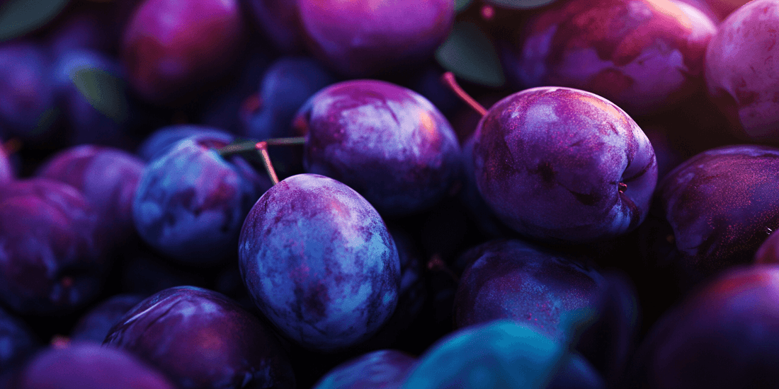 Pile of ripe purple and blue plums