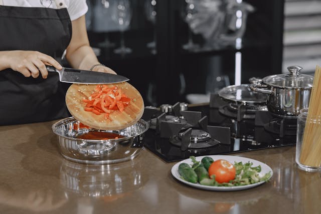 Sliced tomatoes on a Wooden Chopping Board