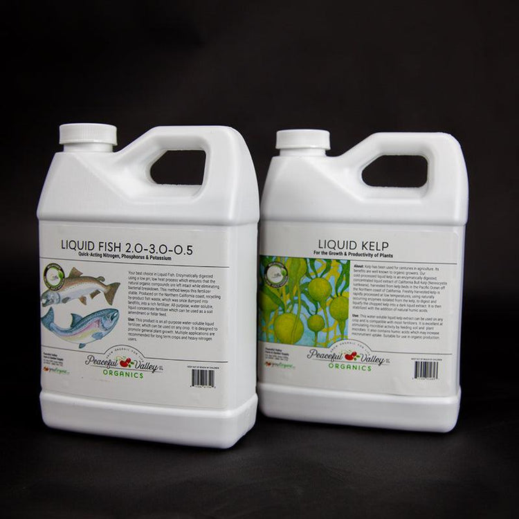 Two white jugs of specialty liquid fertilizer