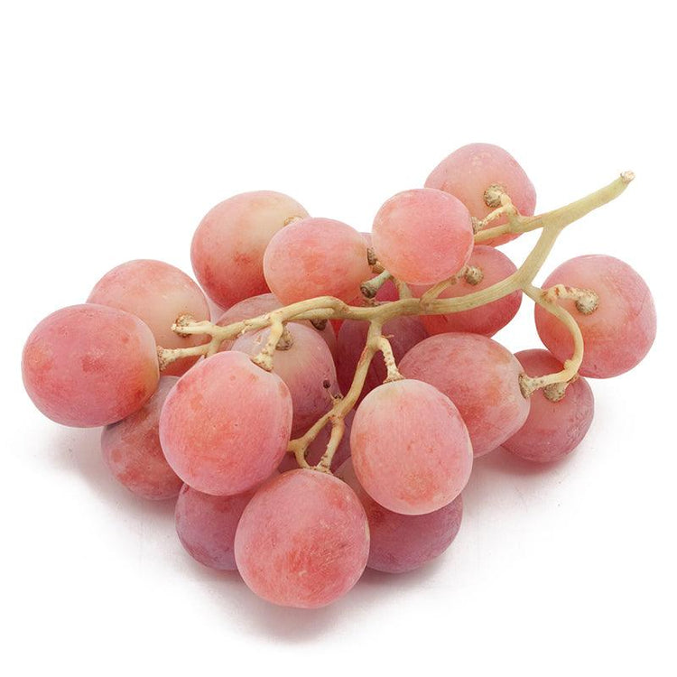 Cluster of pink table grapes on white