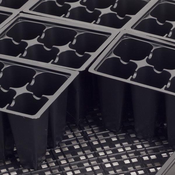 Stack of black plastic nursery pots