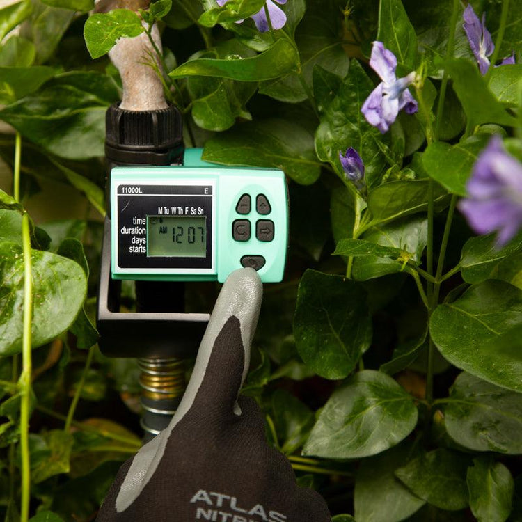 Digital irrigation timer attached to a garden faucet