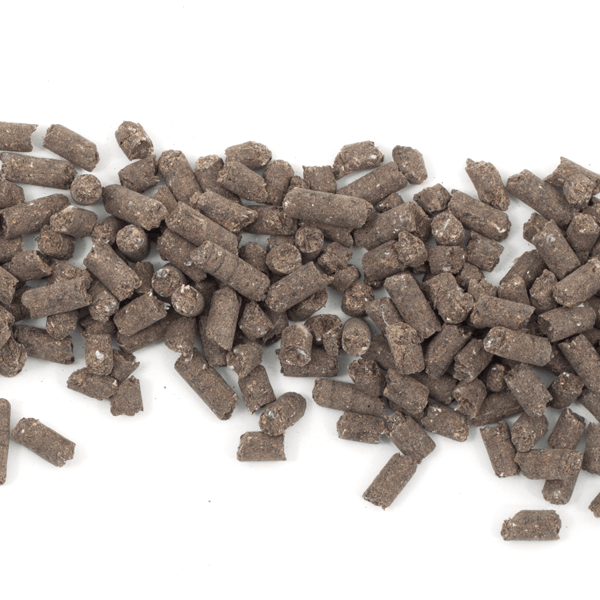 Pile of dark pelleted fertilizer