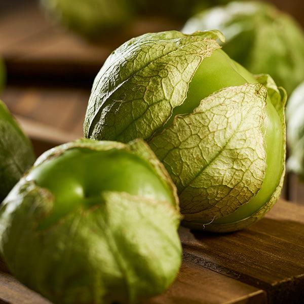 Whole and husked green tomatillos