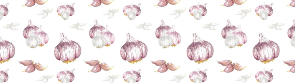 Pattern of garlic bulbs with leaves on a white background