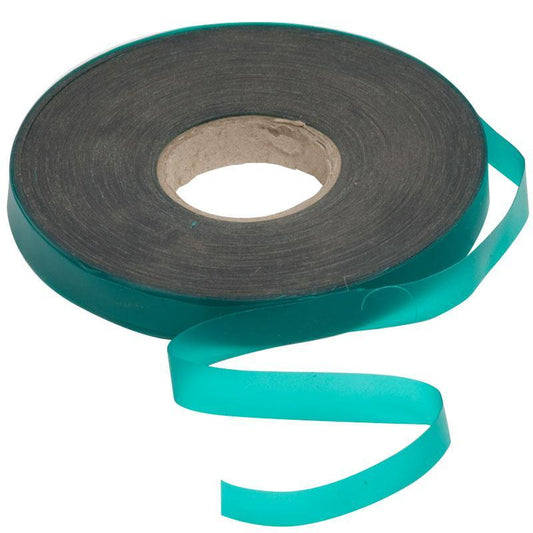 Roll of green vinyl plant tie tape with a loose strip